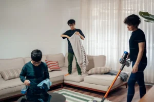 Expert cleaner providing apartment cleaning service in a modern high-rise condo.